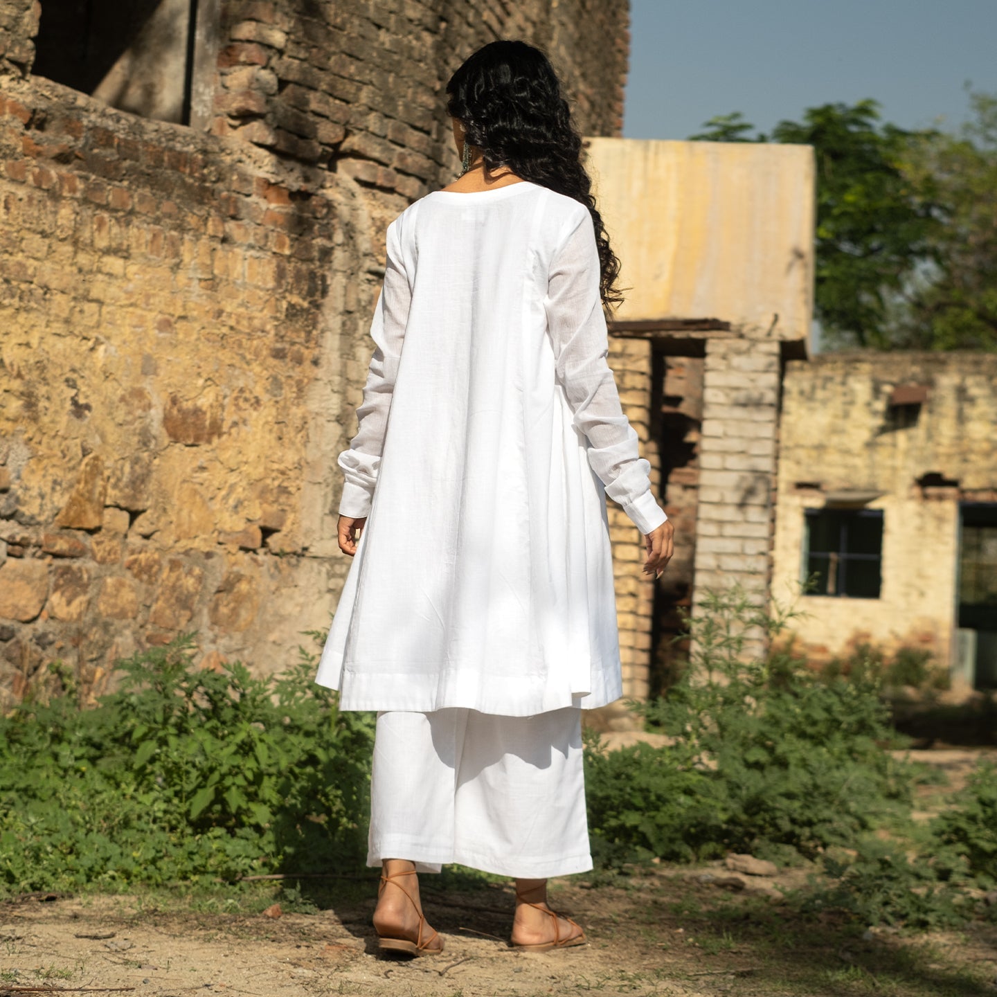 White Cotton round neck knee length Anarkali style Kurta paired with palazzo pants