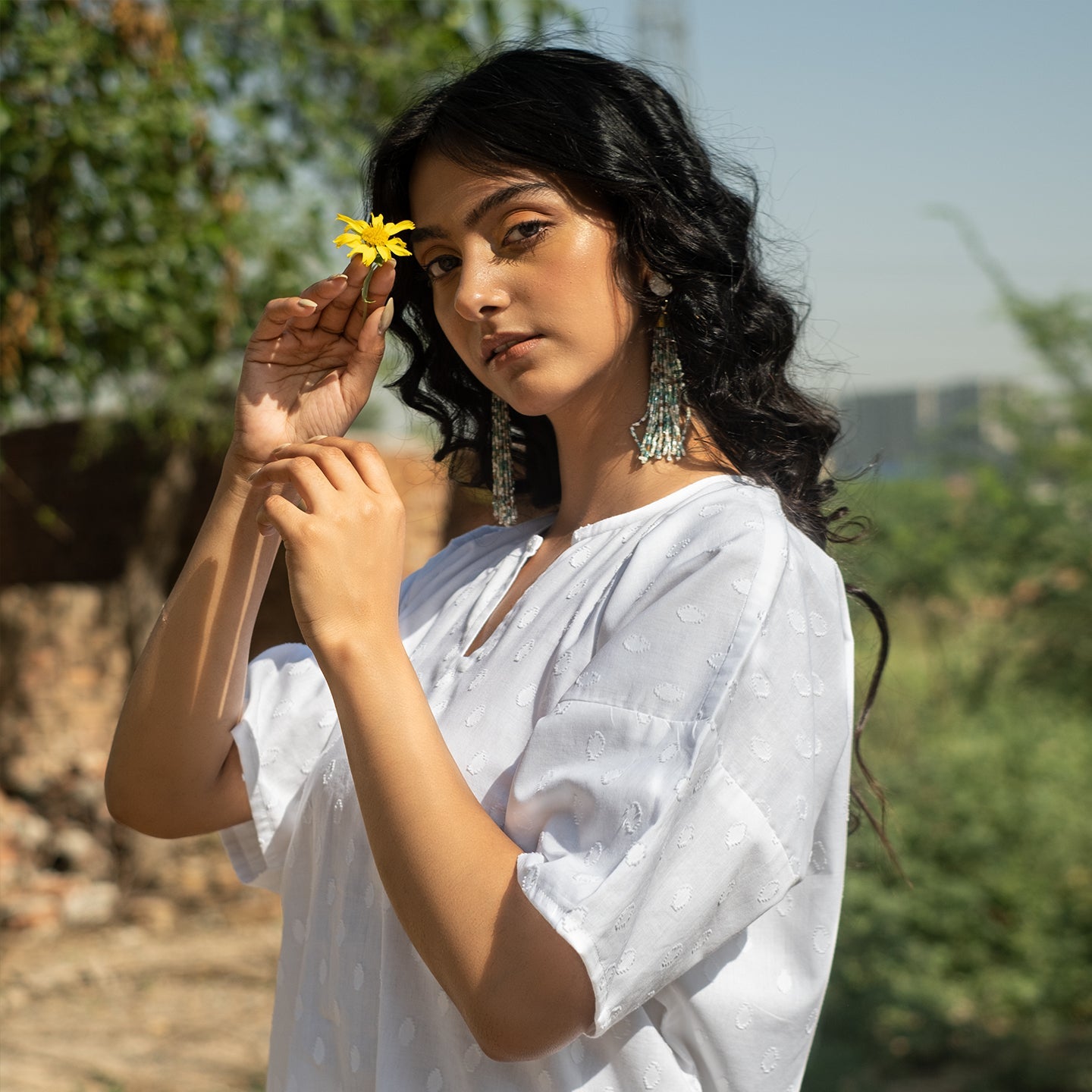 White Oversized short kurta with side slits paired with cigarette pants sets Set