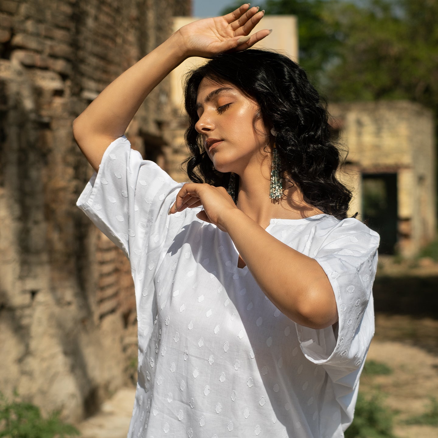 White Oversized short kurta with side slits paired with cigarette pants sets Set
