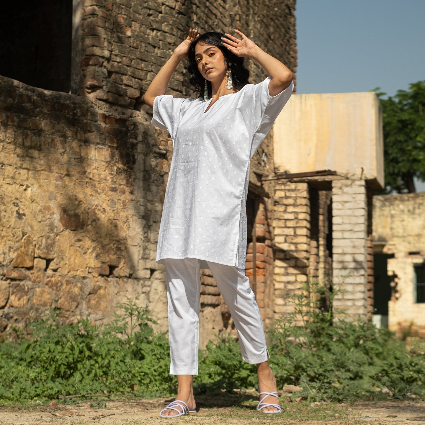White Oversized short kurta with side slits paired with cigarette pants sets Set