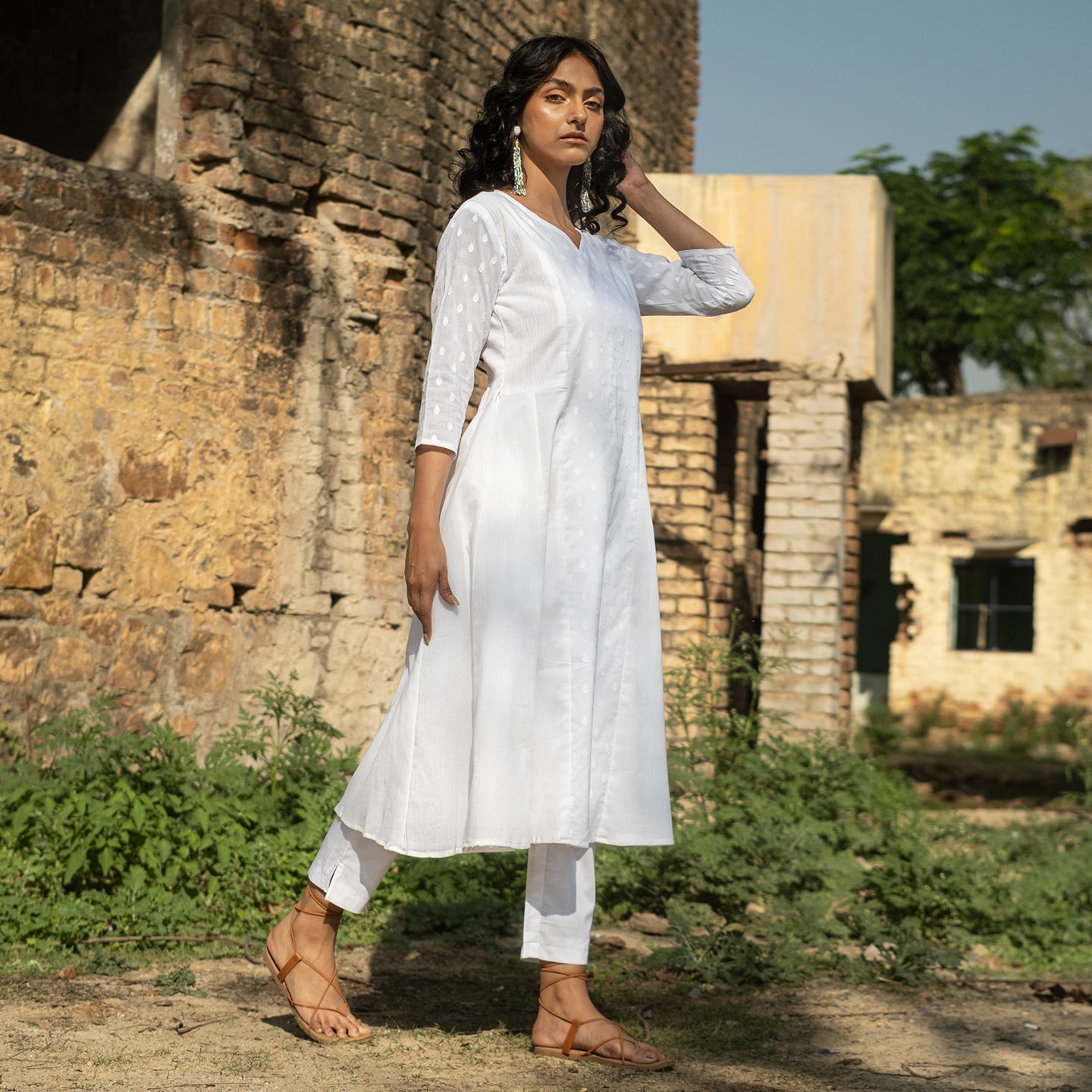White panelled self detail kurta paired with straight fit pants
