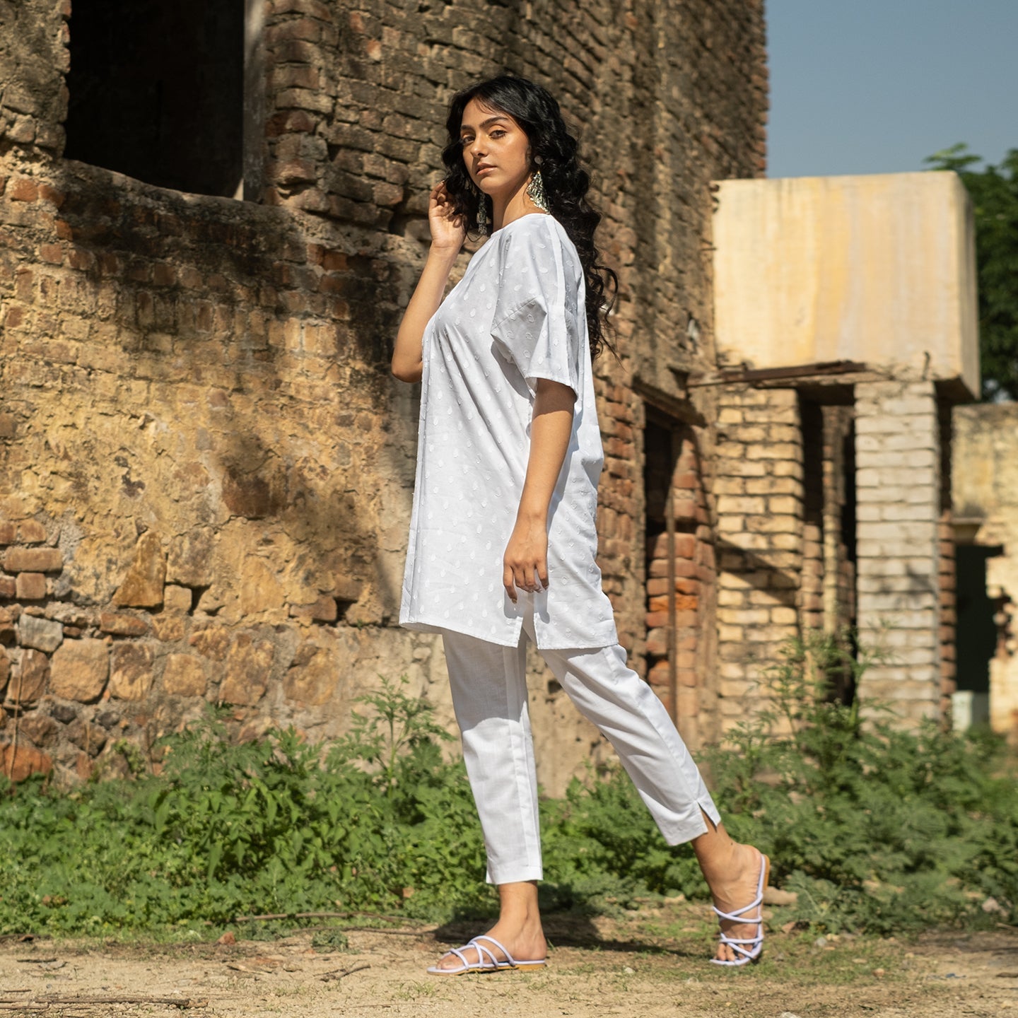 White Oversized short kurta with side slits paired with cigarette pants sets Set