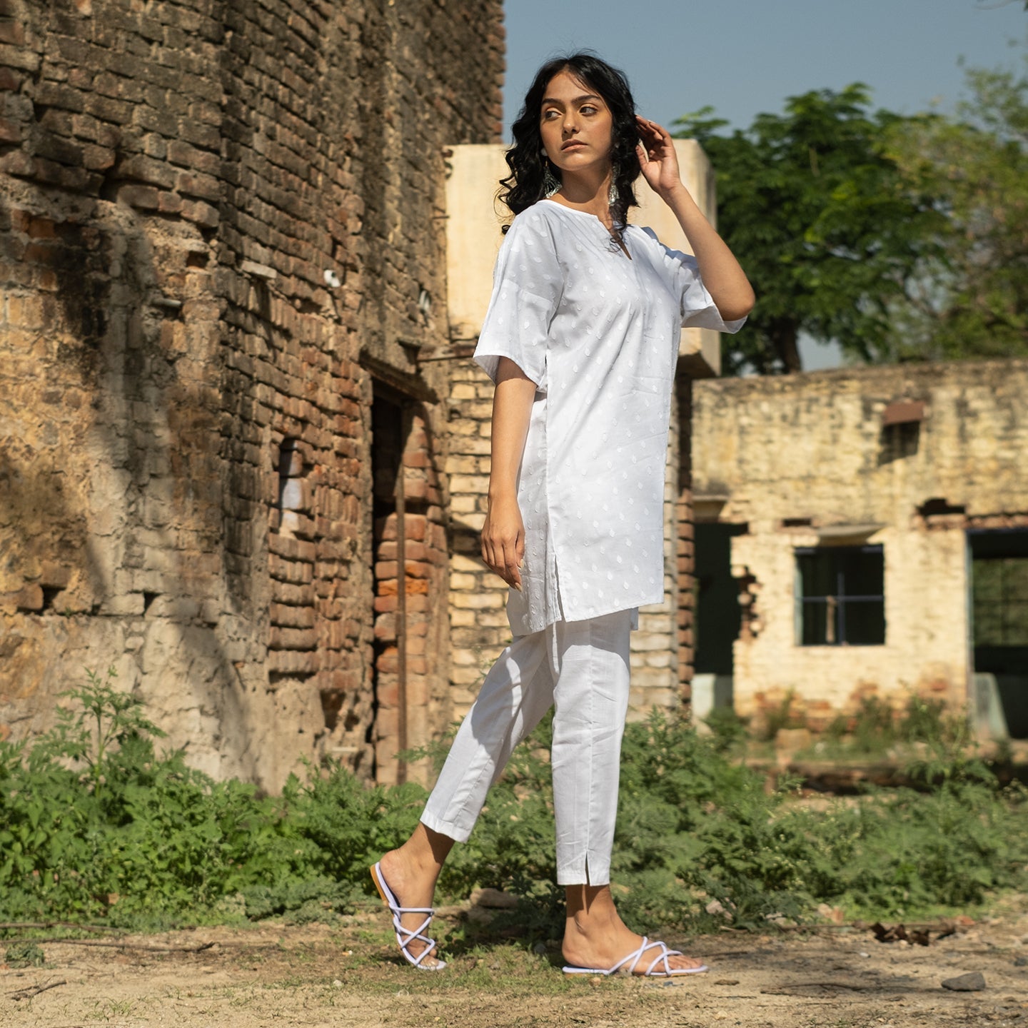 White Oversized short kurta with side slits paired with cigarette pants sets Set