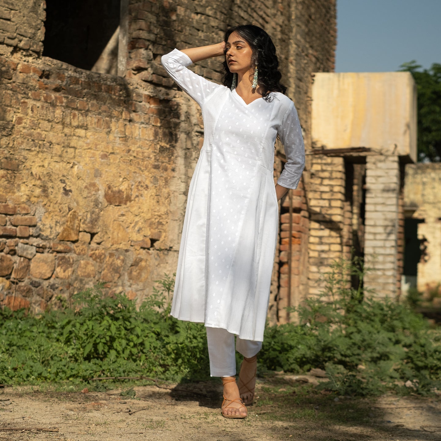 White panelled self detail kurta paired with straight fit pants