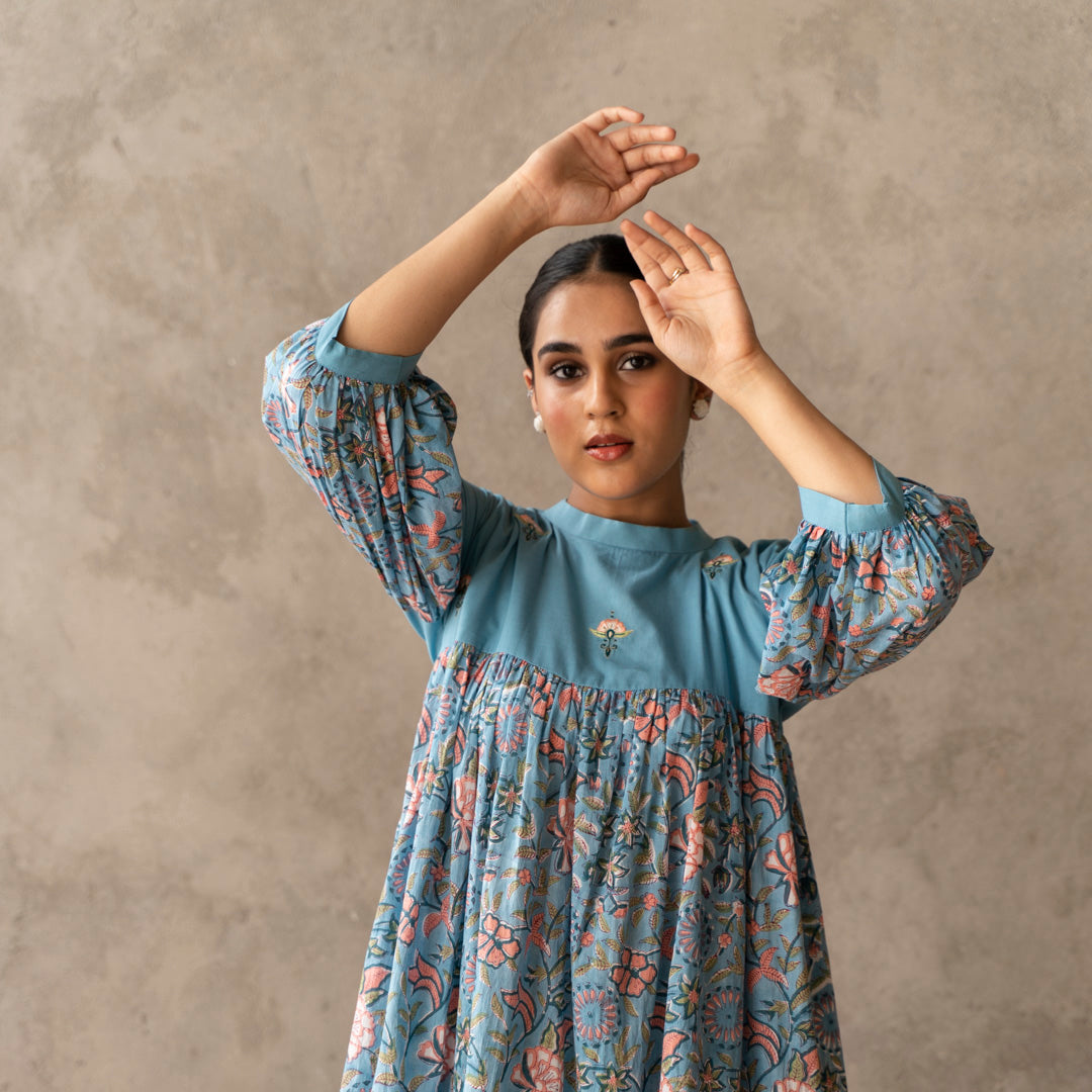 Blue short flared tiered dress with embroidery details
