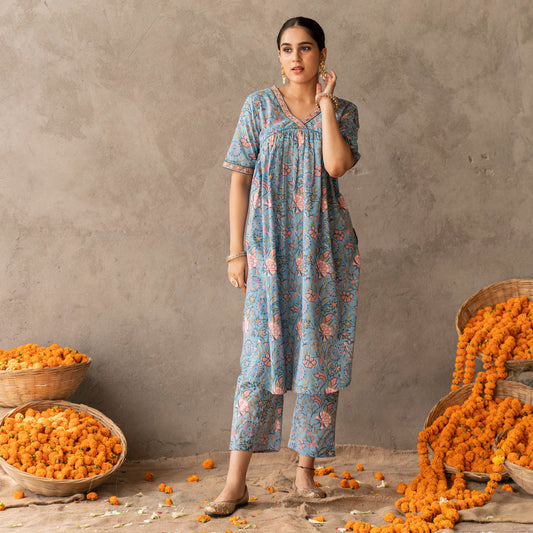Blue block printed A line kurta with hand embroidery details