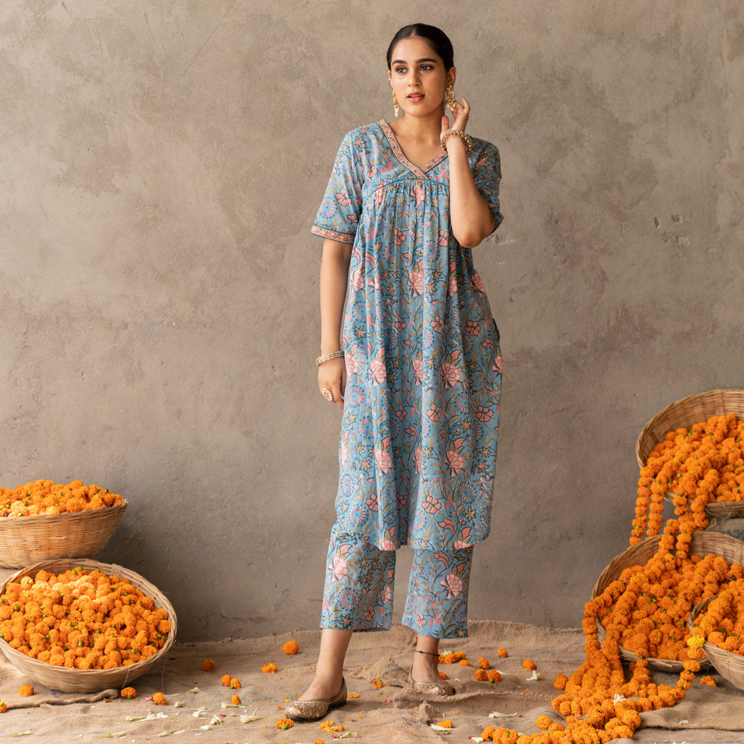 Blue block printed A line with hand embroidery details kurta paired with blue block printed straight pants set