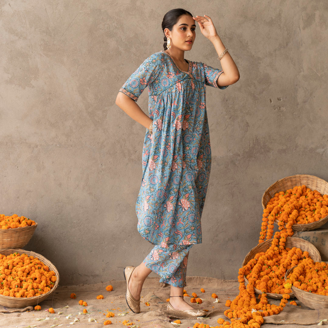 Blue block printed A line with hand embroidery details kurta paired with blue block printed straight pants set