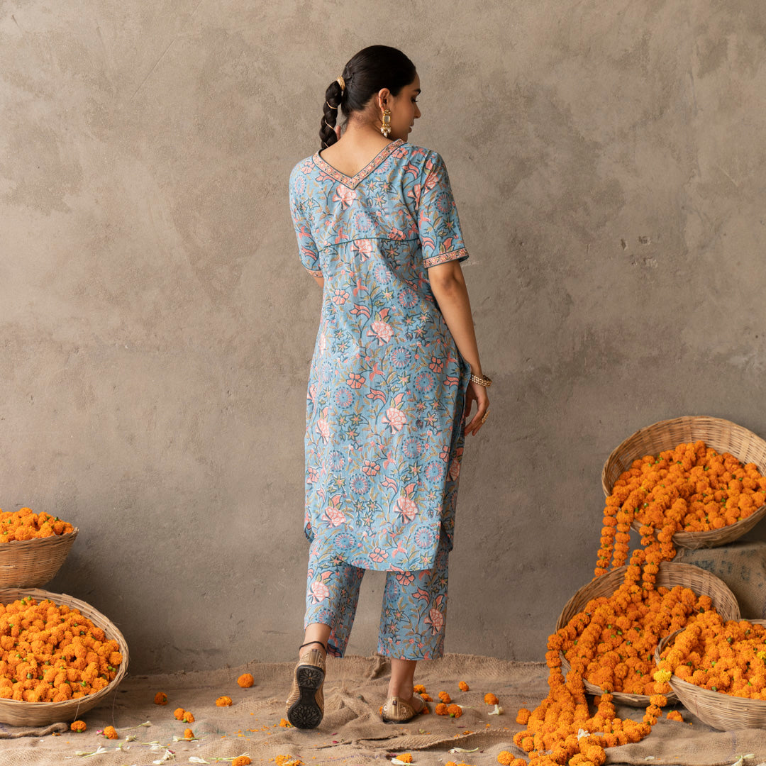 Blue block printed A line with hand embroidery details kurta paired with blue block printed straight pants set