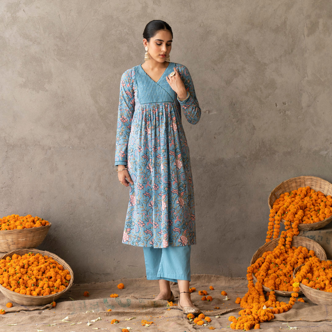 Blue block printed with yoke and sleeve detailed A line kurta paired with blue solid straight pants set