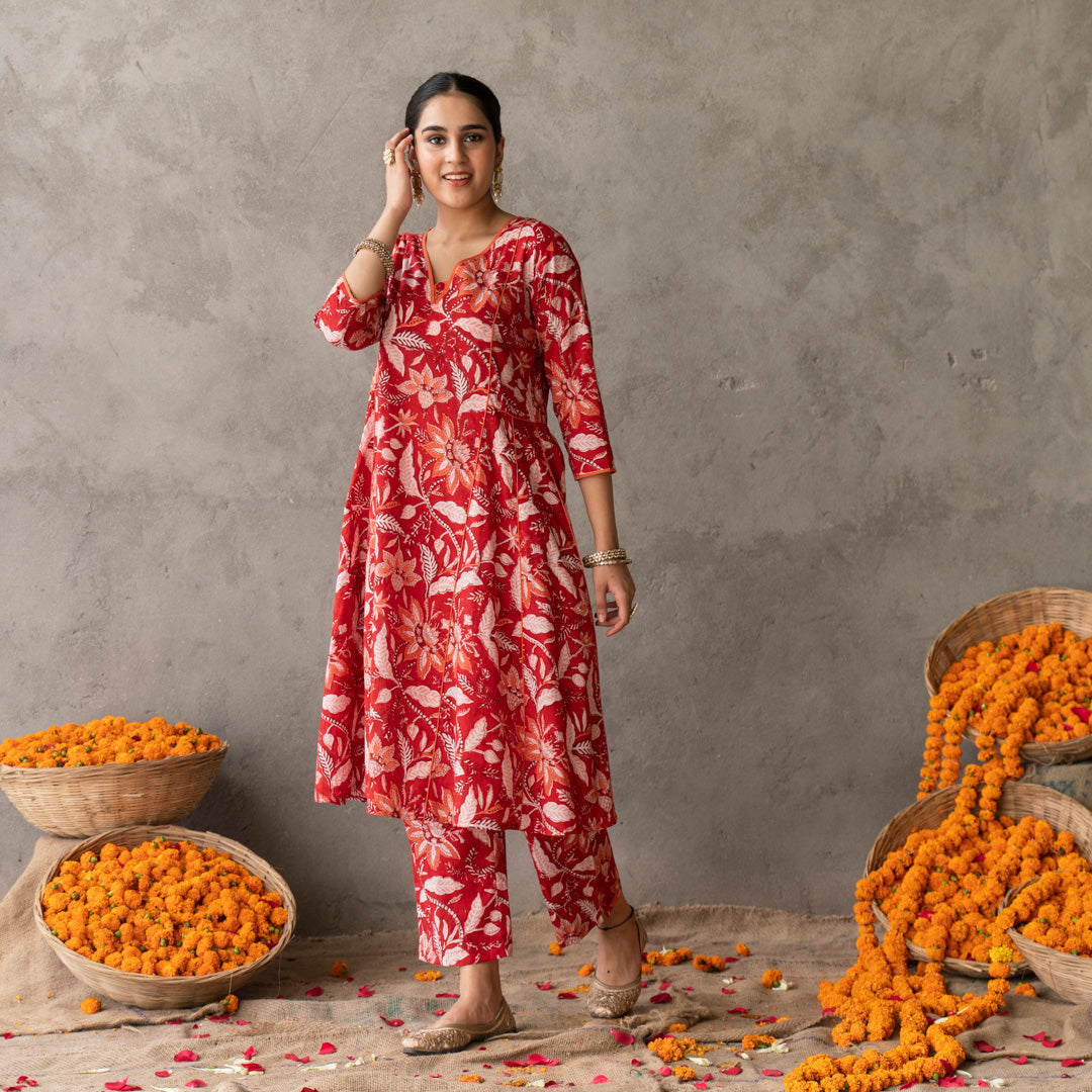 Red block printed panelled anarkali kurta with contrast piping detail paired with red block printed straight pants set