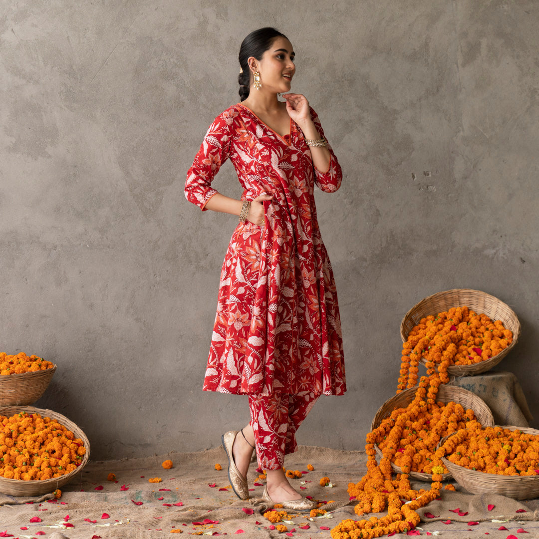 Red block printed panelled anarkali kurta with contrast piping detail paired with red block printed straight pants set