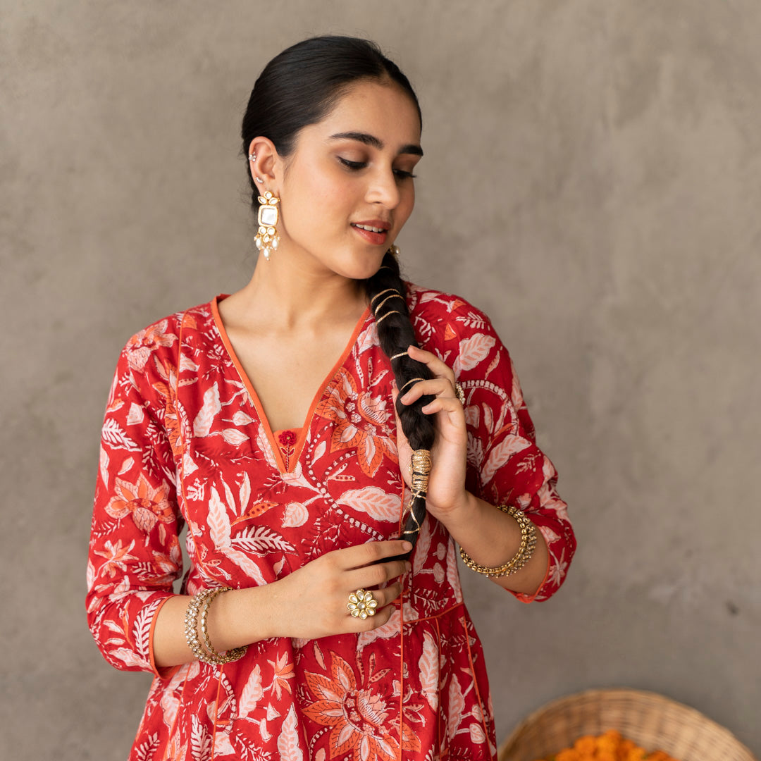 Red block printed panelled anarkali kurta with contrast piping detail paired with red block printed straight pants set