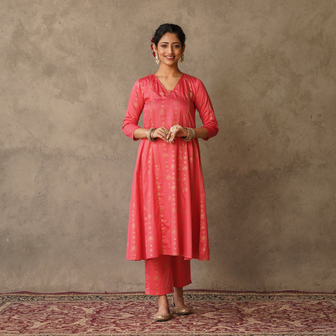 Coral block printed Anarkali kurta with hand embroidery and piping details