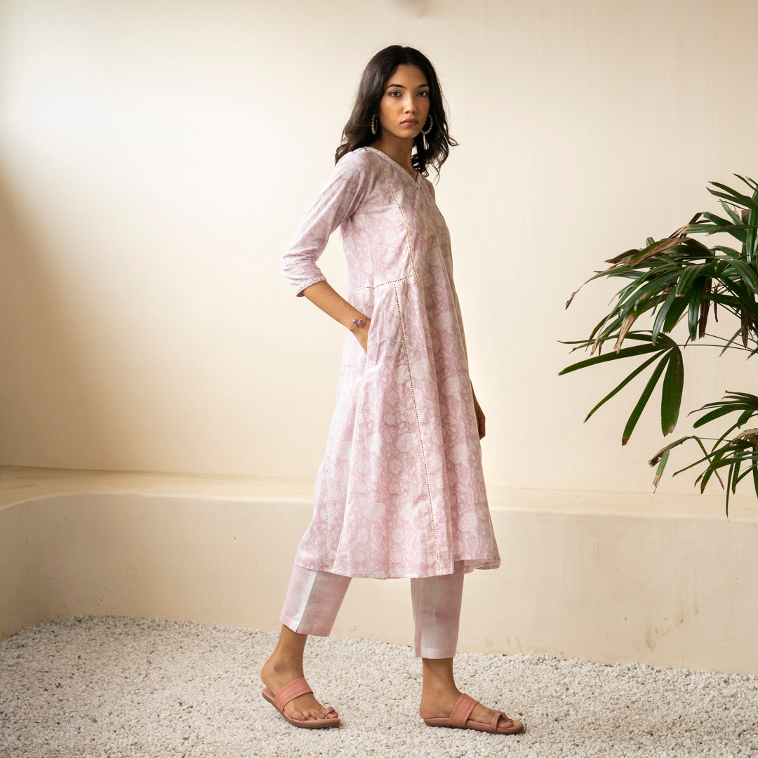 Blush pink block printed Anarkali kurta with embroidery detail neckline paired with shibori tie dye trousers set