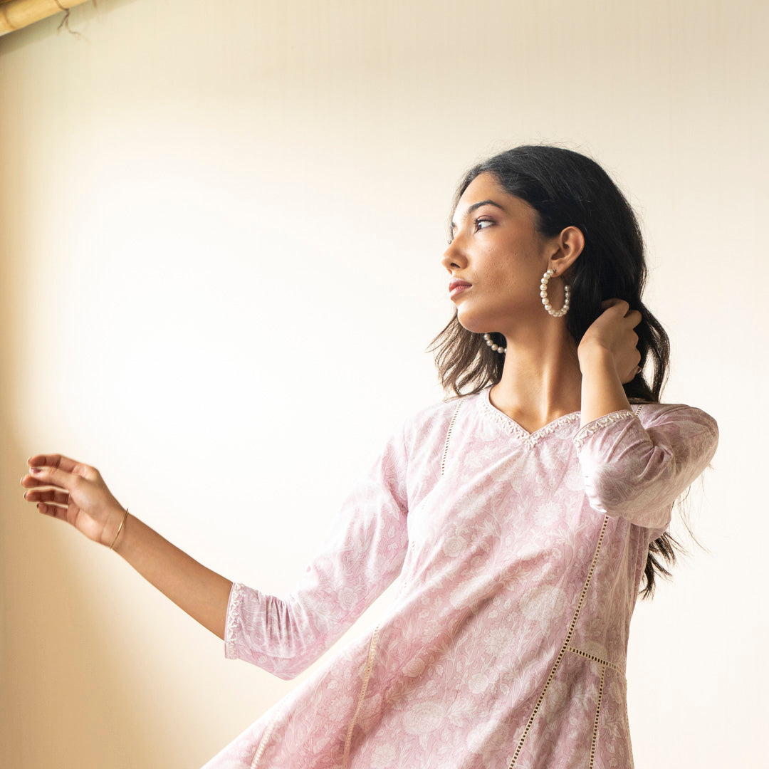 Blush pink block printed Anarkali kurta with embroidery detail neckline paired with shibori tie dye trousers set