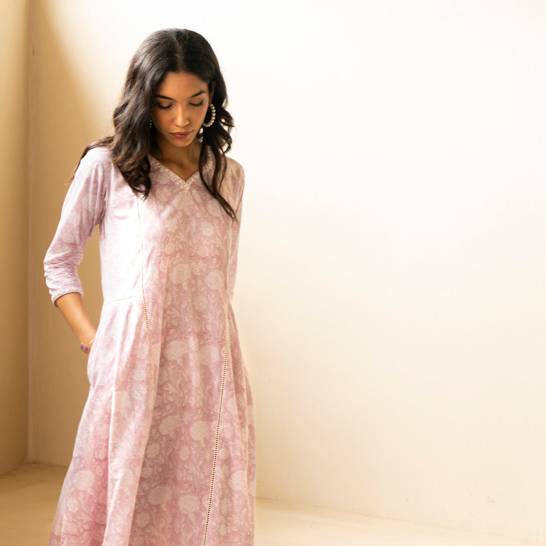 Blush pink block printed Anarkali kurta with embroidery detail neckline paired with shibori tie dye trousers set