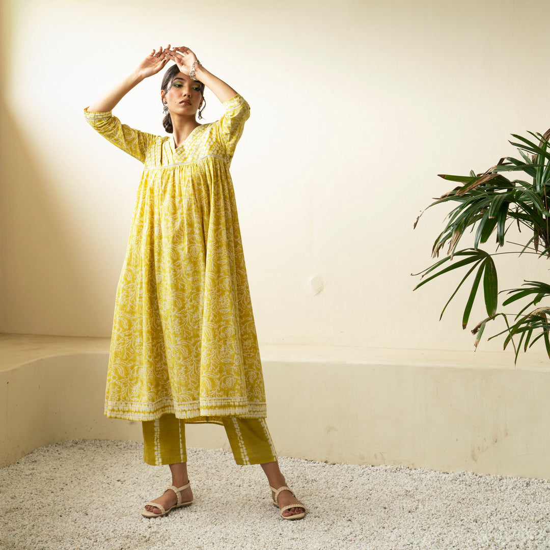 Chartreuse green block printed Anarkali kurta with V Neck with pleat detail neckline with Shibori tie dye trousers