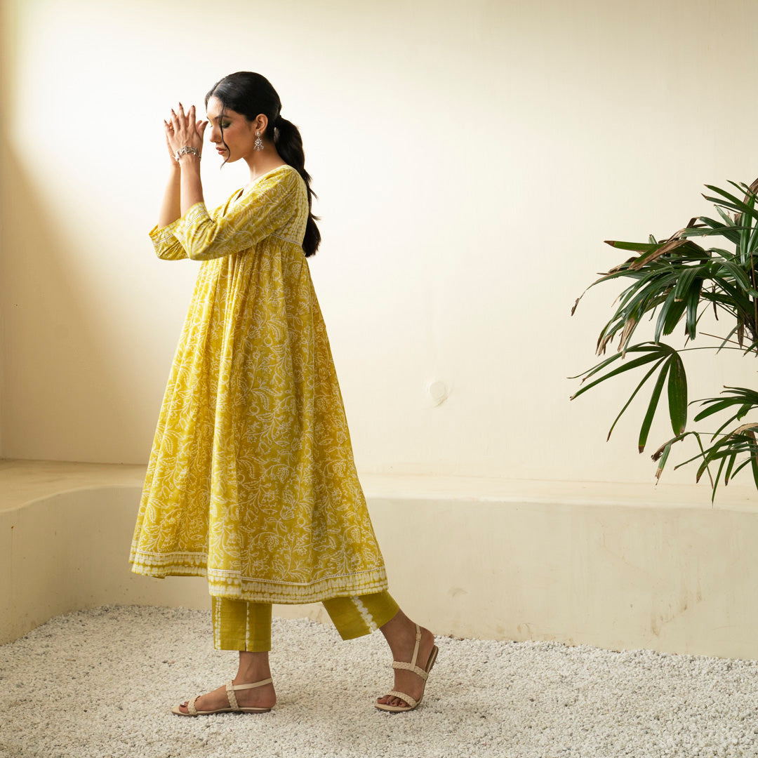 Chartreuse green block printed Anarkali kurta with V Neck with pleat detail neckline with Shibori tie dye trousers