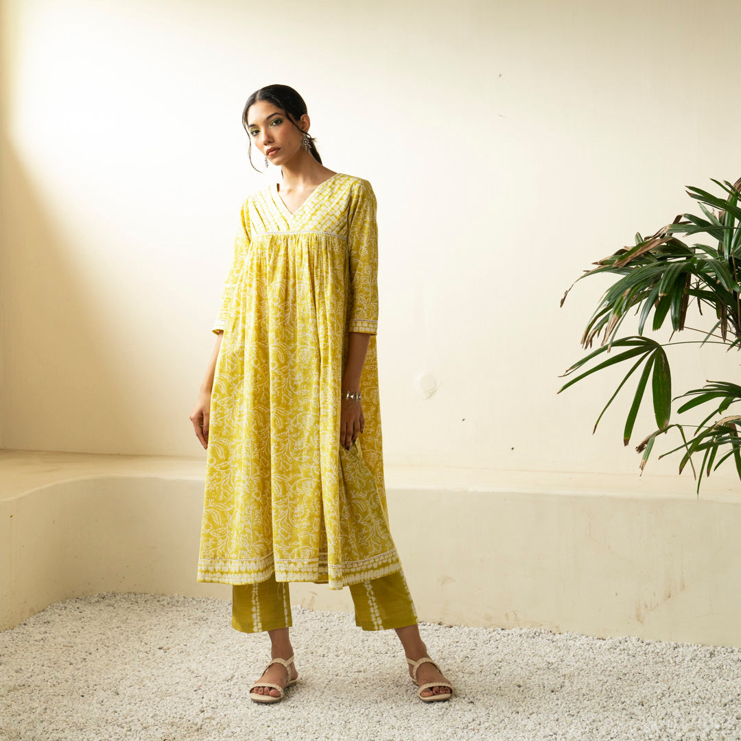 Chartreuse green block printed Anarkali kurta with V Neck with pleat detail neckline with Shibori tie dye trousers