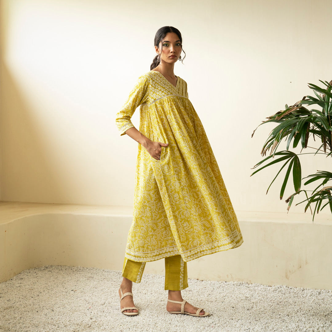 Chartreuse green block printed Anarkali kurta with V Neck with pleat detail neckline with Shibori tie dye trousers