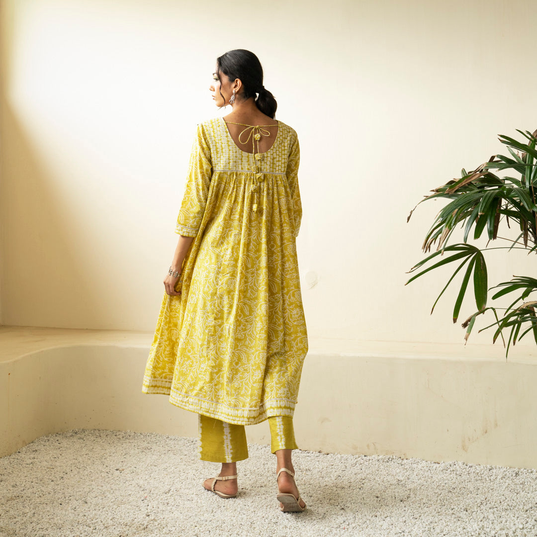 Chartreuse green block printed Anarkali kurta with V Neck with pleat detail neckline with Shibori tie dye trousers