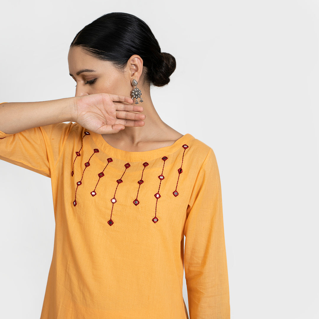 Mirror Work on Orange Suit