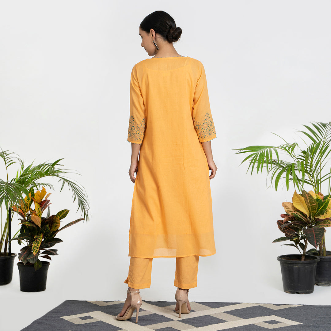 Geometric Work on Orange Suit with Solid Dupatta