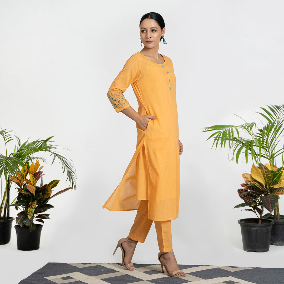 Geometric Work on Orange Suit with Solid Dupatta