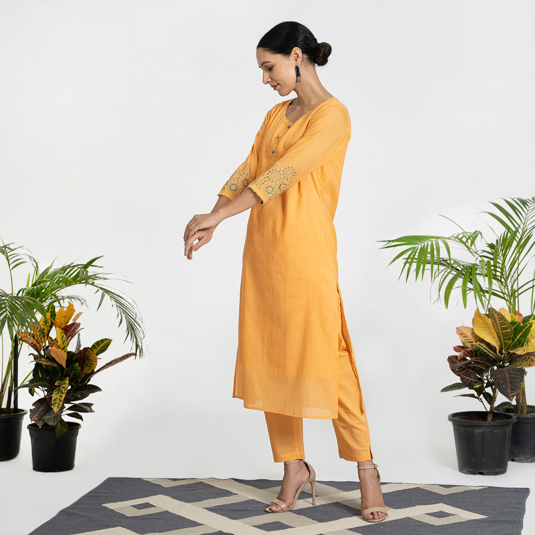Geometric Work on Orange Suit with Solid Dupatta