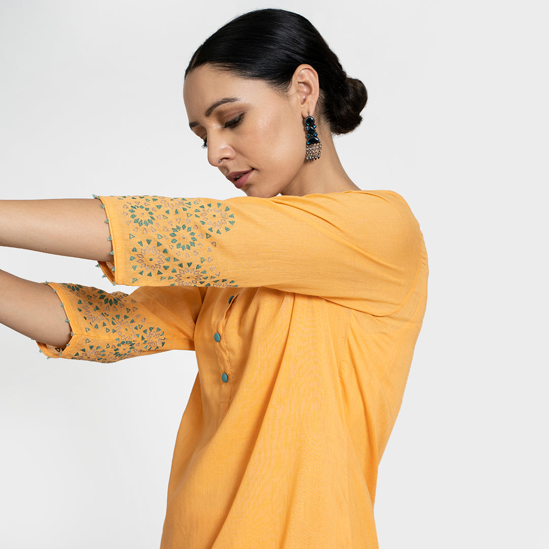 Geometric Work on Orange Suit with Solid Dupatta