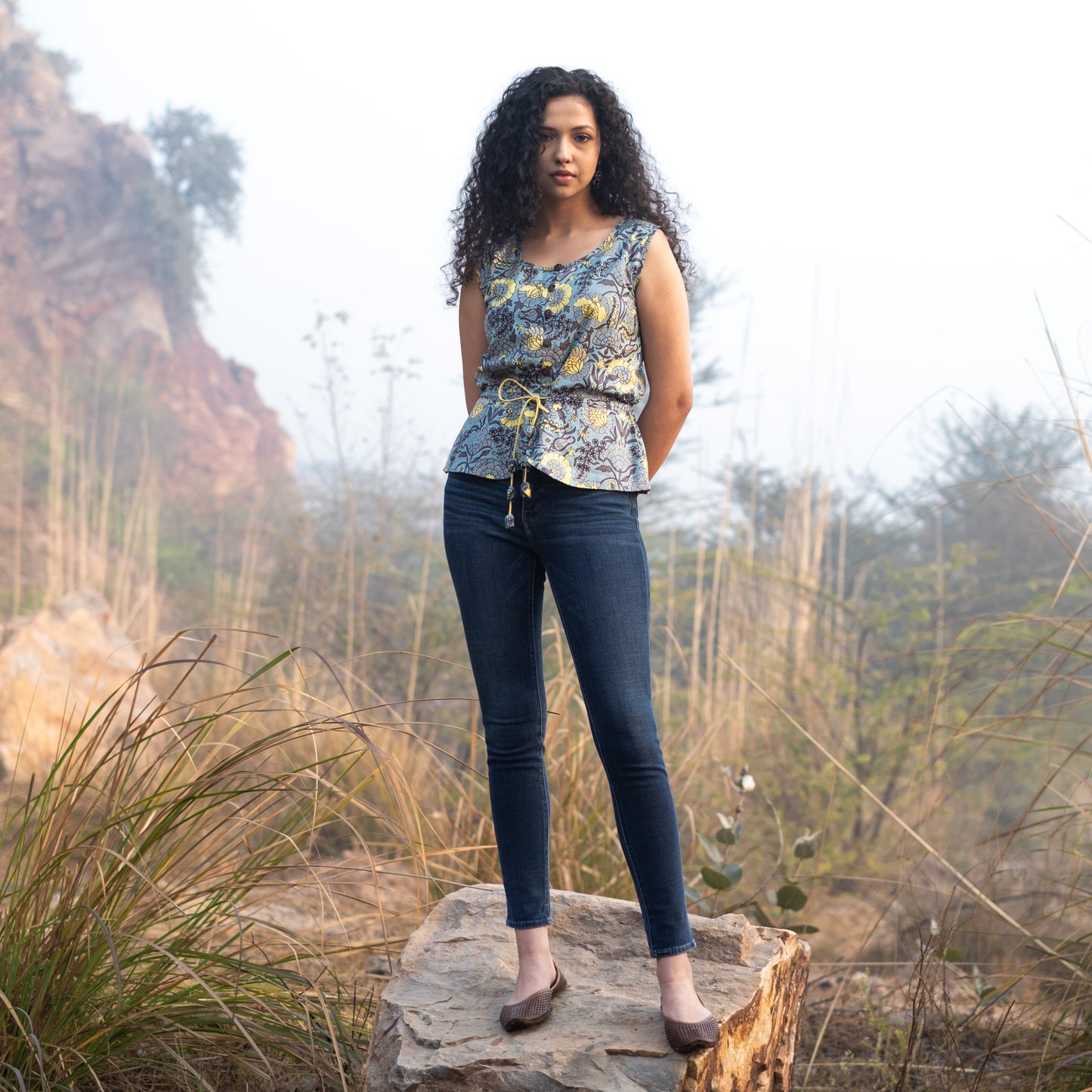 Sleeveless Peplum top with tieup at waist