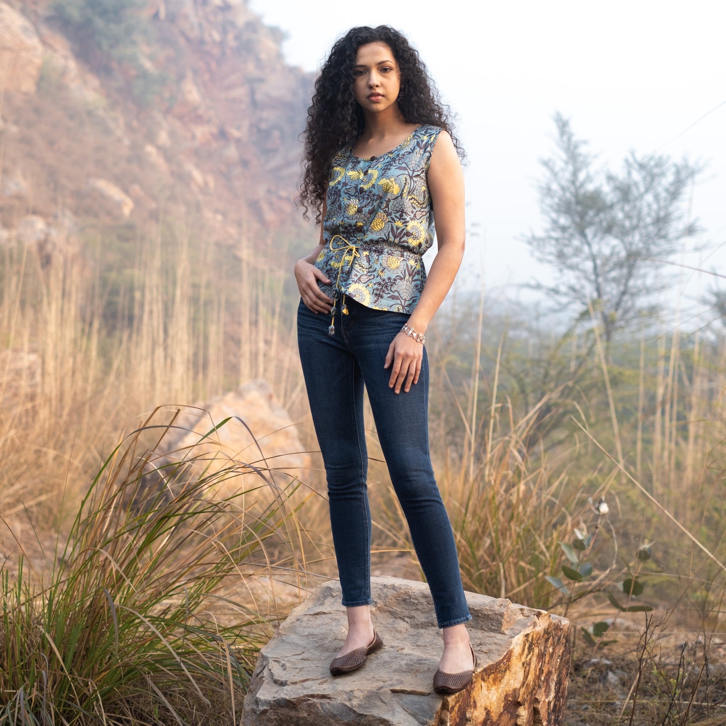 Sleeveless Peplum top with tieup at waist