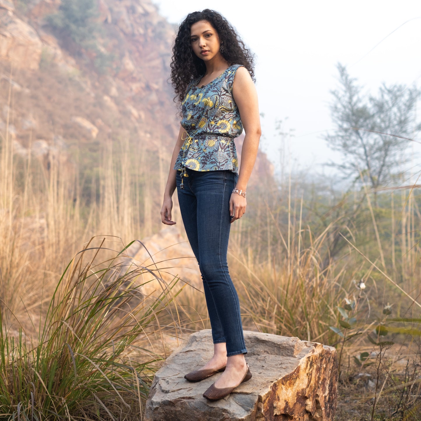 Sleeveless Peplum top with tieup at waist