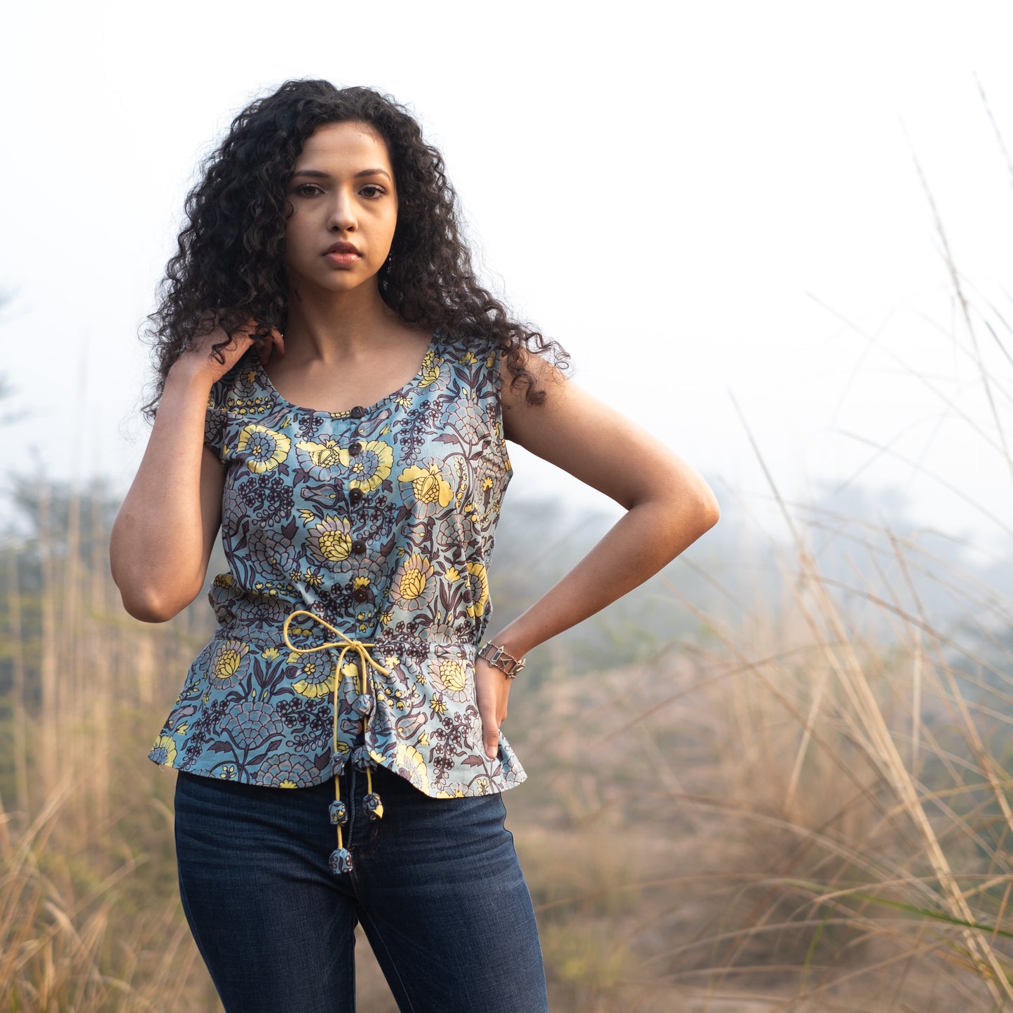 Sleeveless Peplum top with tieup at waist