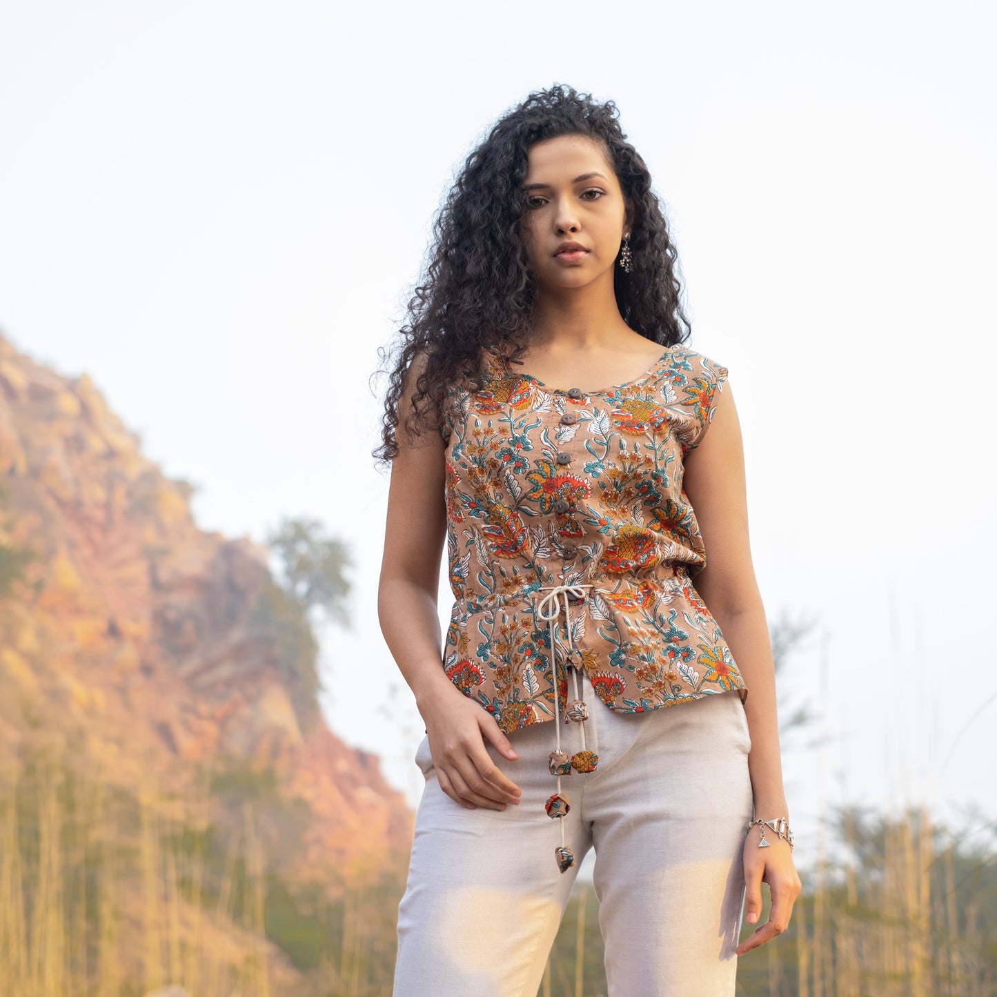 Sleeveless Peplum top with tieup at waist