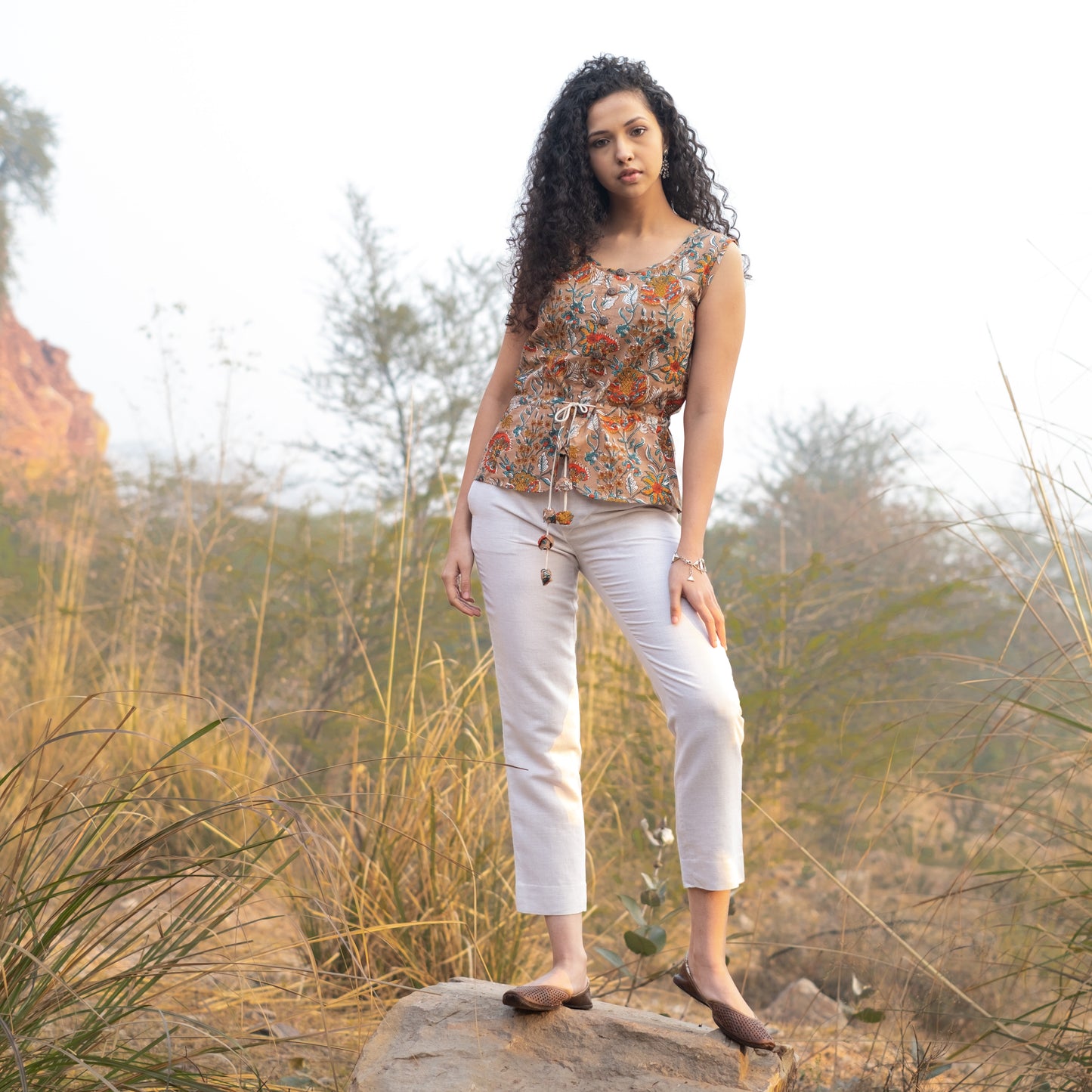 Sleeveless Peplum top with tieup at waist