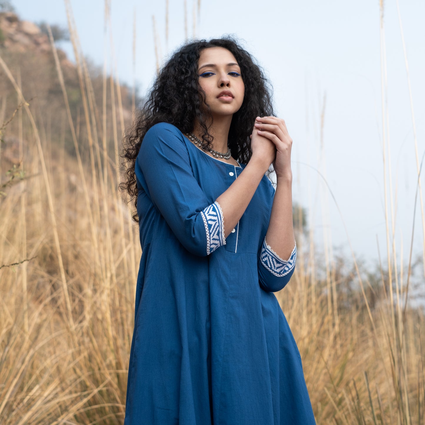 Solid indigo Anarkali kurta with block print border and lace details