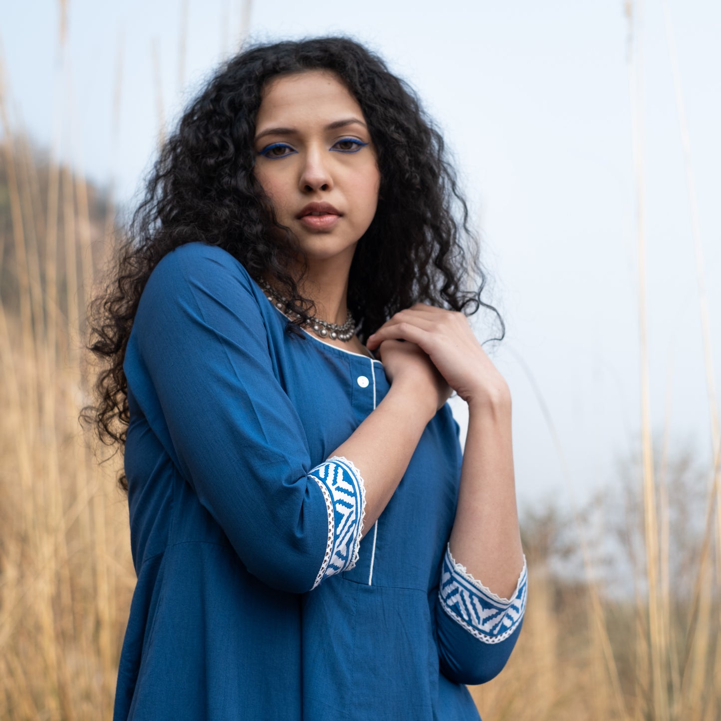 Solid indigo Anarkali kurta with block print border and lace details