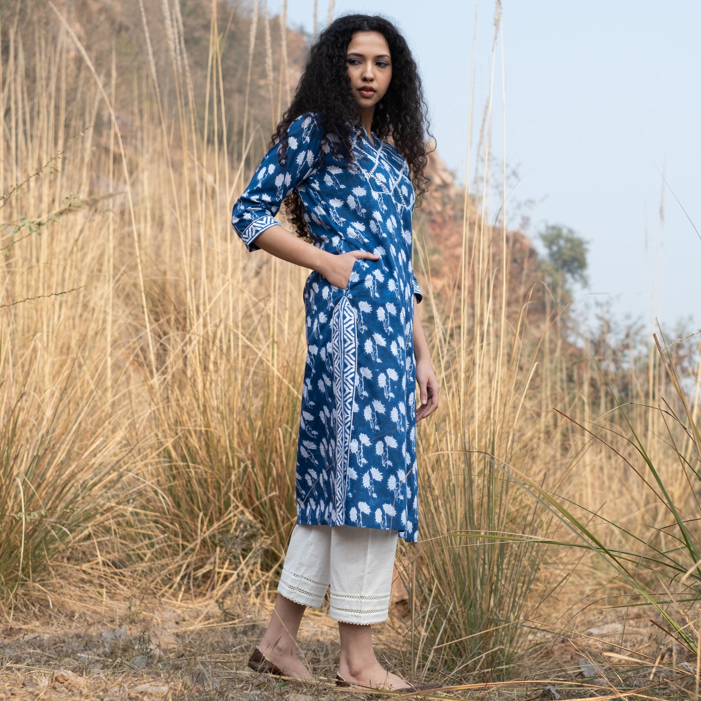 Indigo block printed kurta with lace detail on yoke, sides and sleeves and white pants (set of 2)