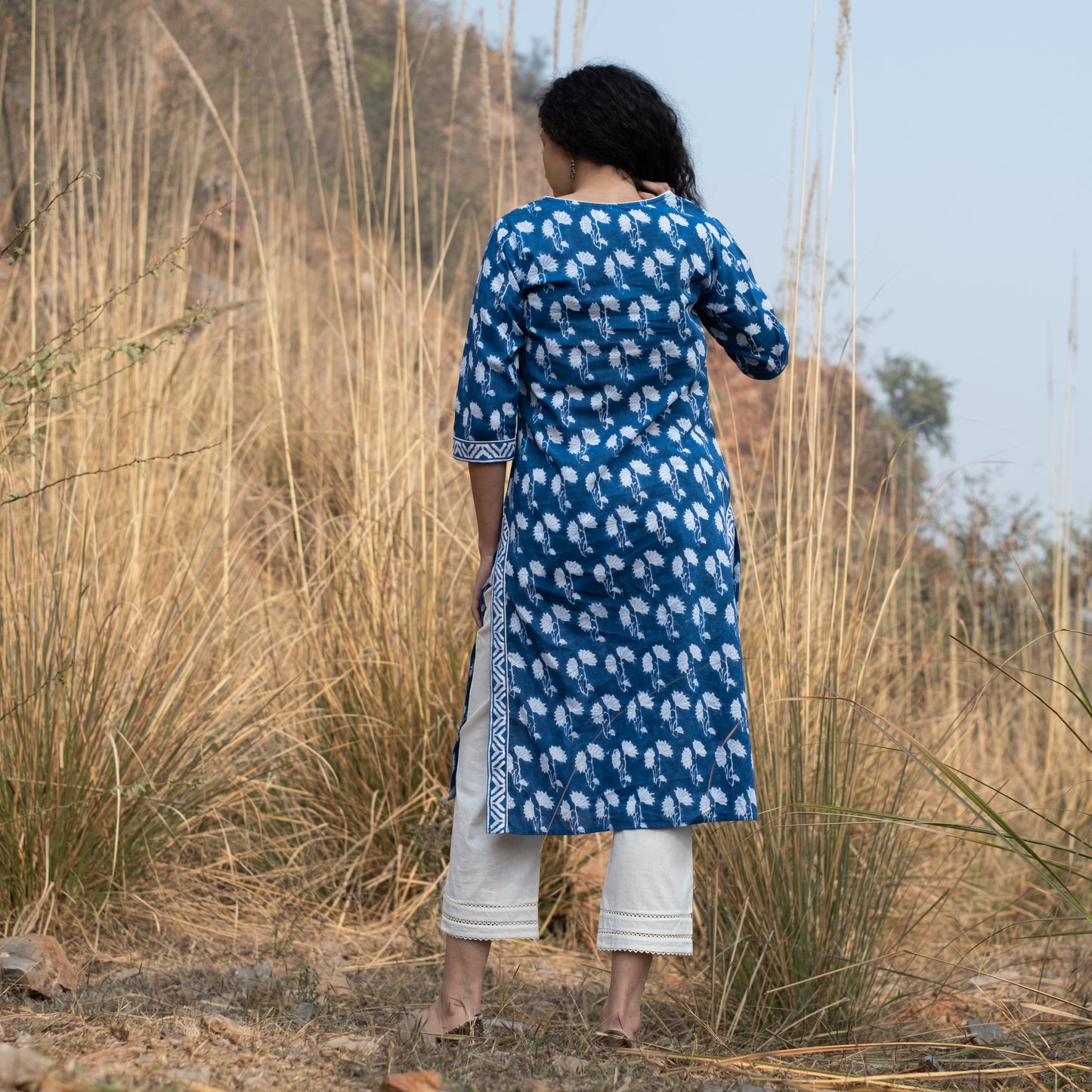 Indigo block printed kurta with lace detail on yoke, sides and sleeves and white pants (set of 2)