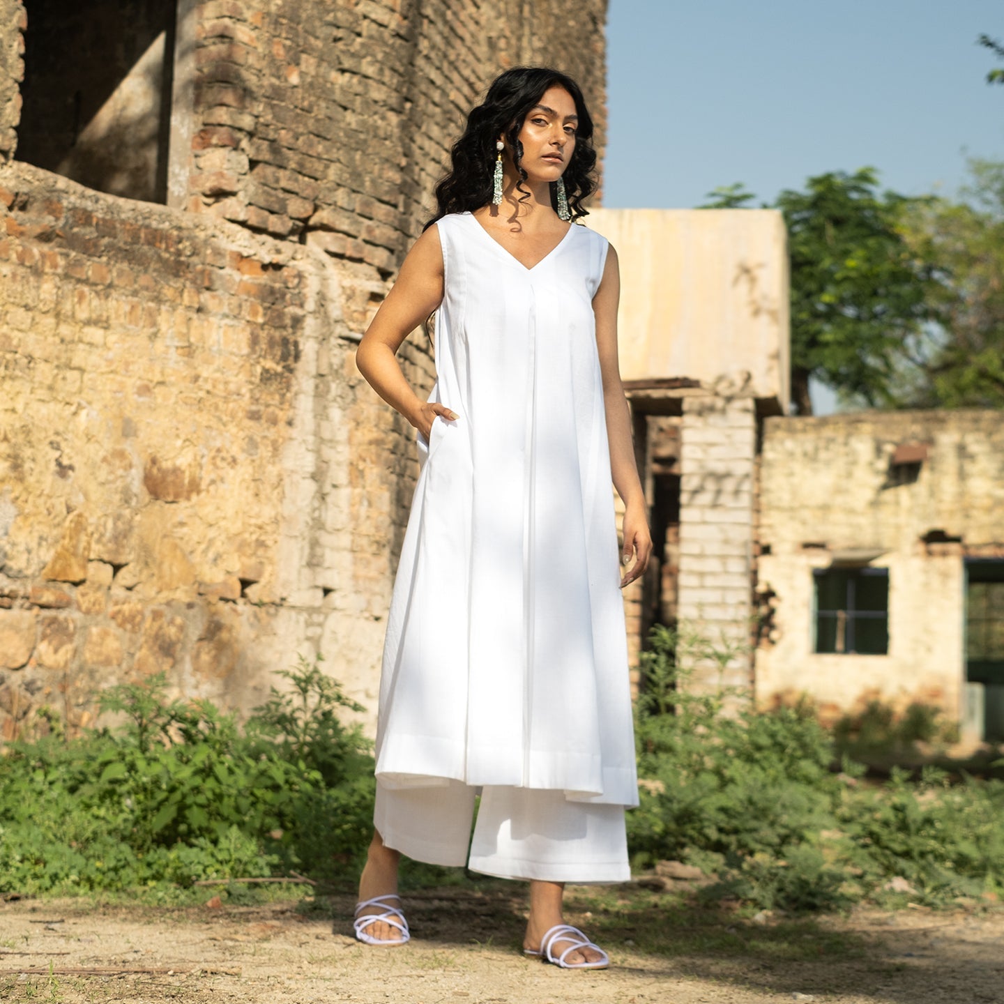 White A-line flared front pleat detail kurta paired with palazzo pants