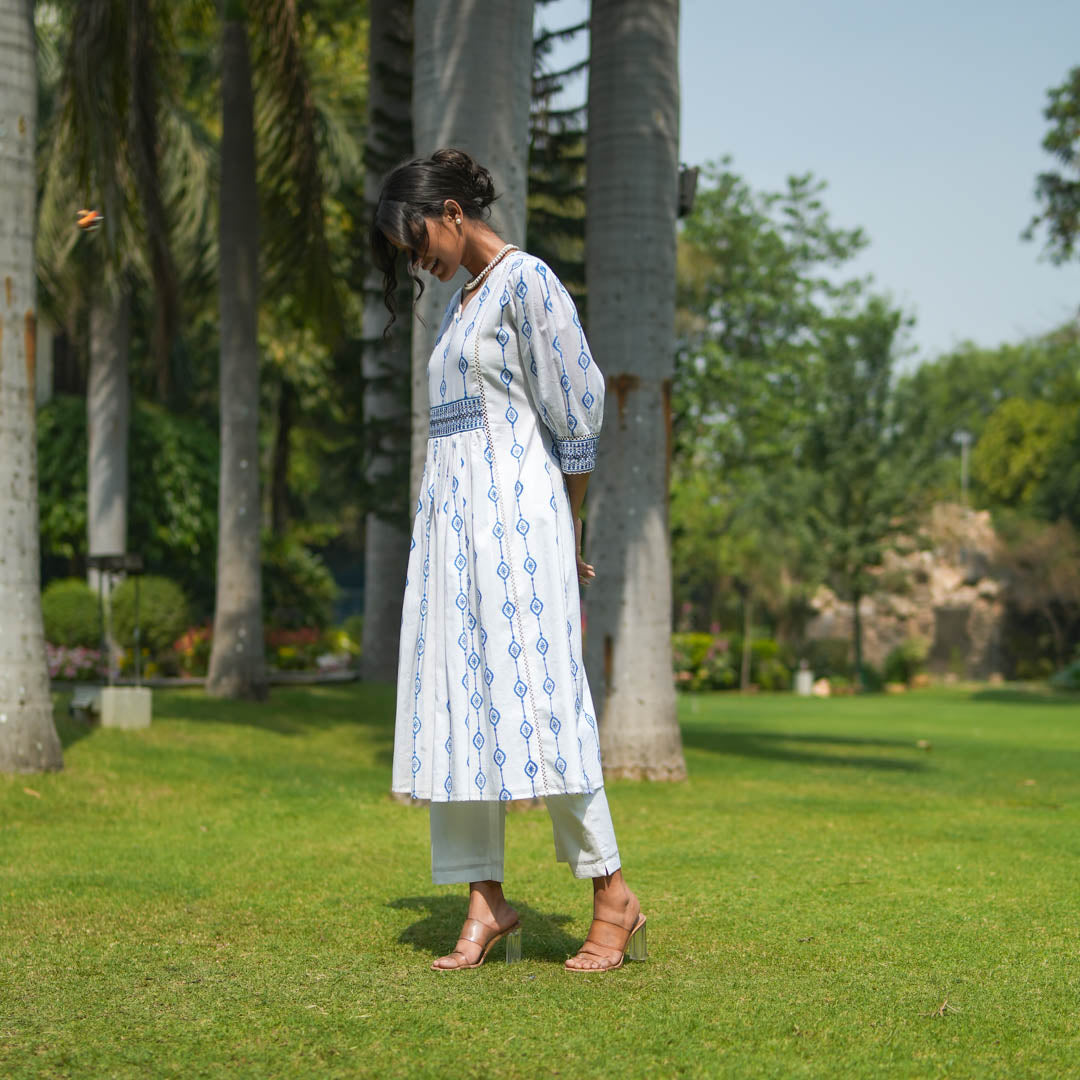 White Hand Block Printed Fit and Flare Kurta Set with Embroidered Waist Detail and Back Tie-up( set of 2 )