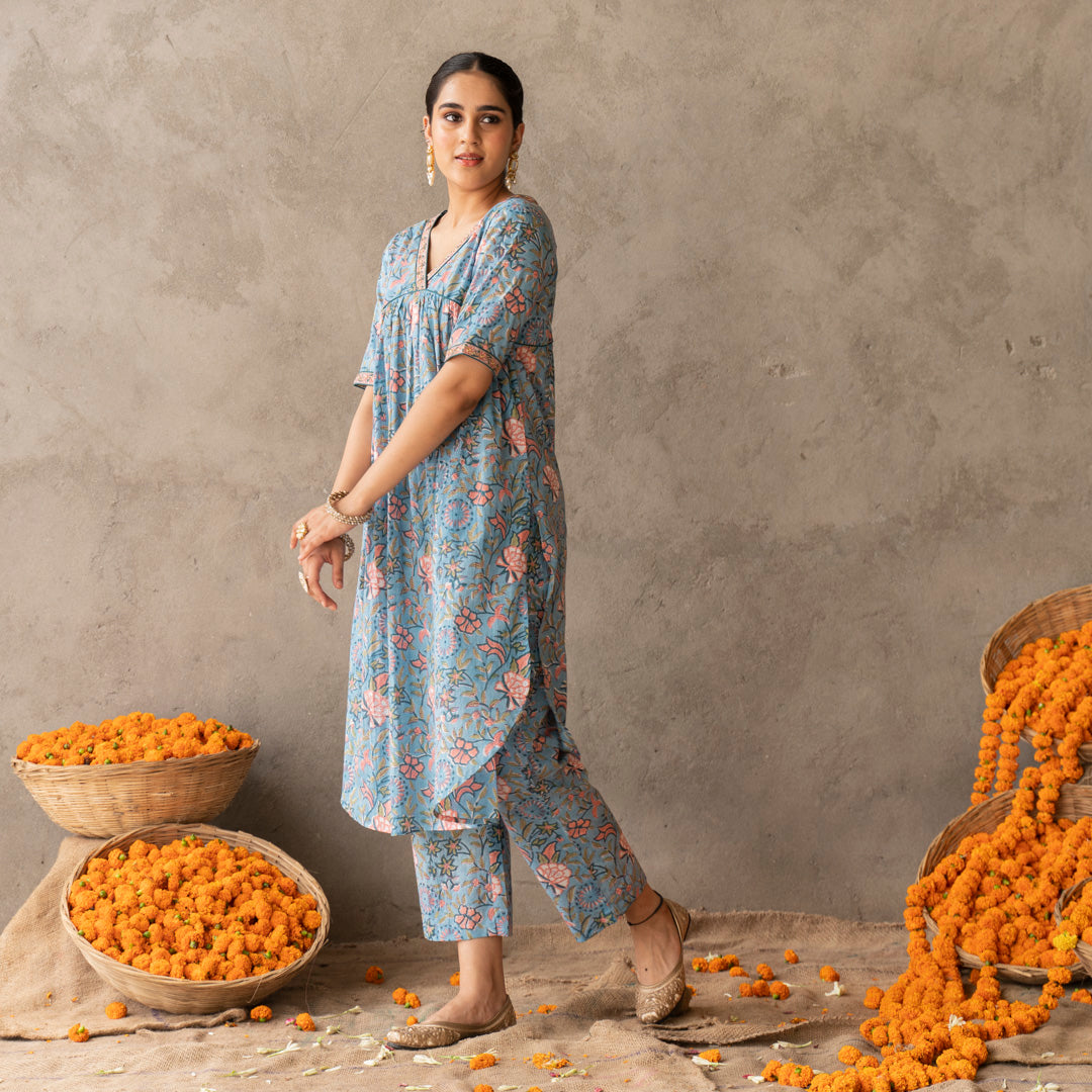 Blue block printed A line with hand embroidery details kurta paired with blue block printed straight pants set
