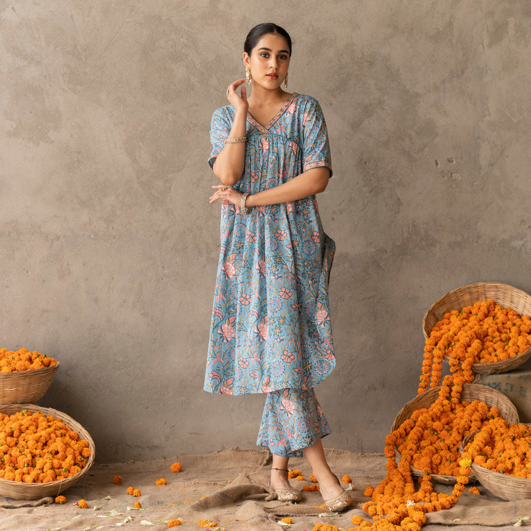 Blue block printed A line with hand embroidery details kurta paired with blue block printed straight pants set