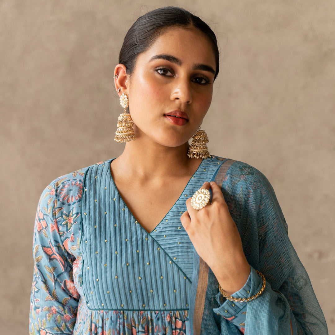 Blue block printed with yoke and sleeve detailed A line kurta paired with blue solid straight pants set