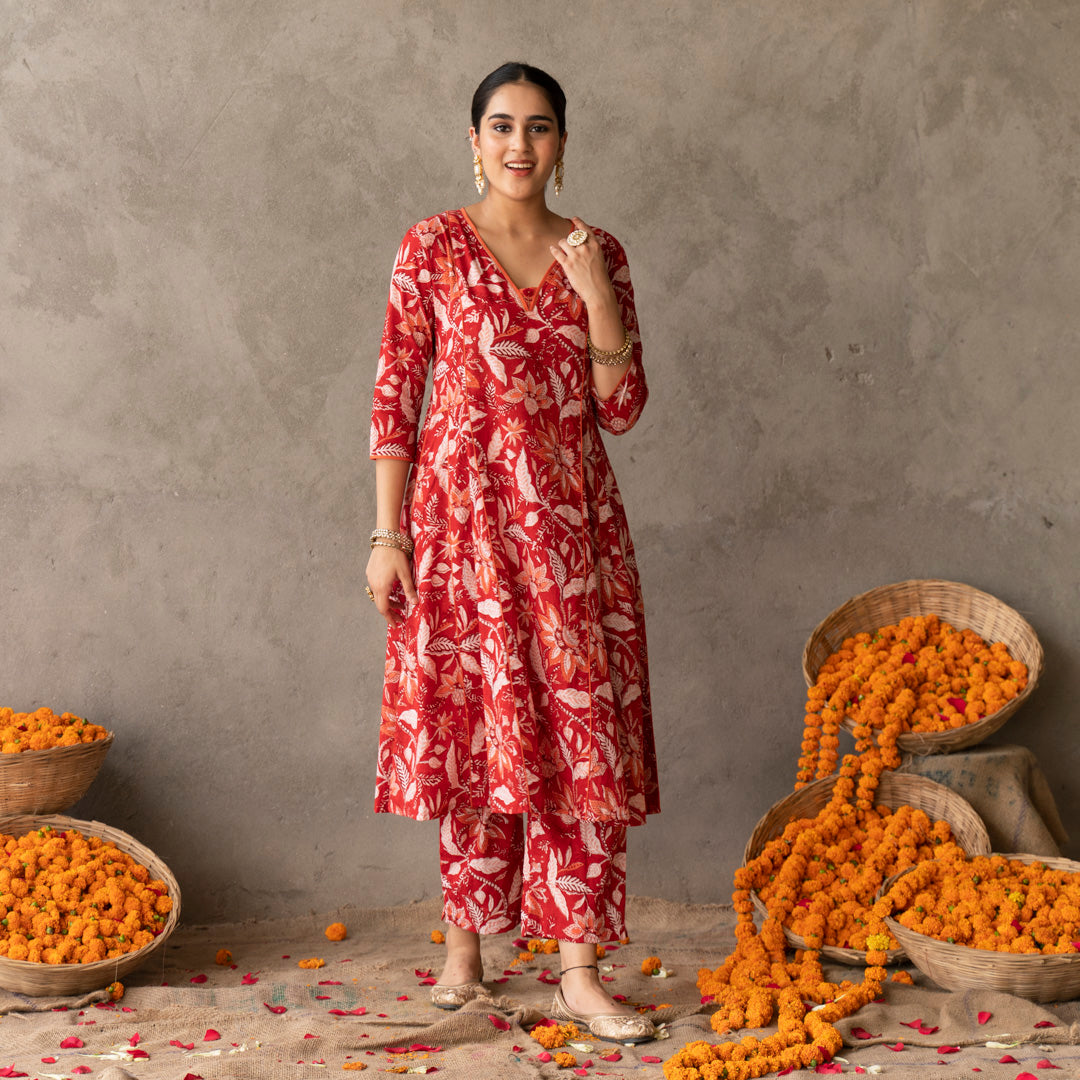 Red block printed panelled anarkali kurta with contrast piping detail paired with red block printed straight pants set