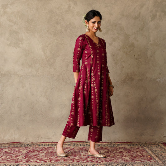 Plum Block Printed Anarkali Kurta with Hand Embroidery and Piping Details Paired with Matching Gold Block Printed Straight Pants Set  (Set of 2)
