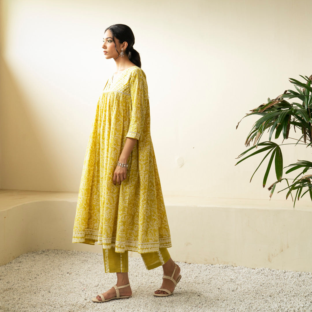 Chartreuse green block printed Anarkali kurta with V Neck with pleat detail neckline with Shibori tie dye trousers