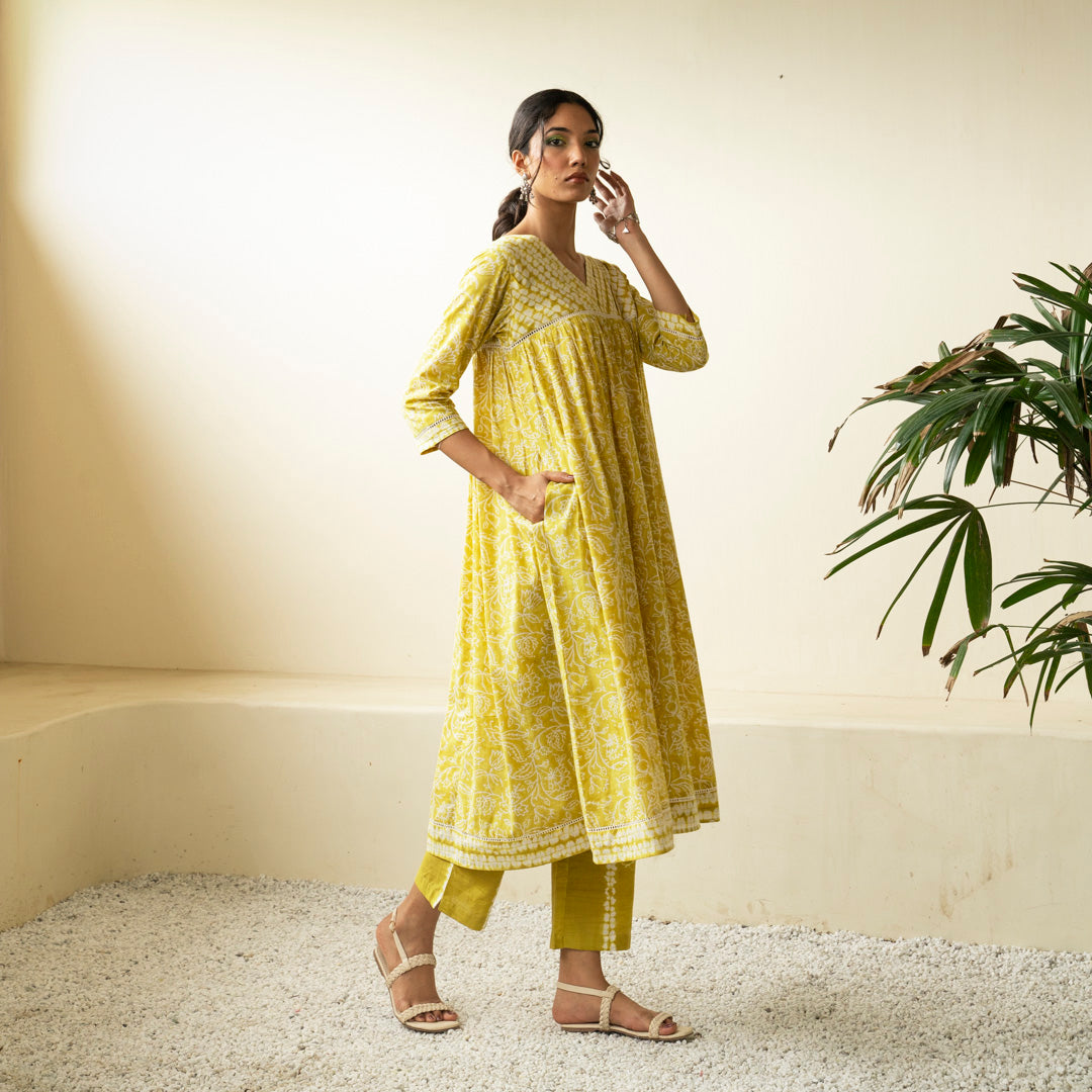 Chartreuse green block printed Anarkali kurta with V Neck with pleat detail neckline with Shibori tie dye trousers